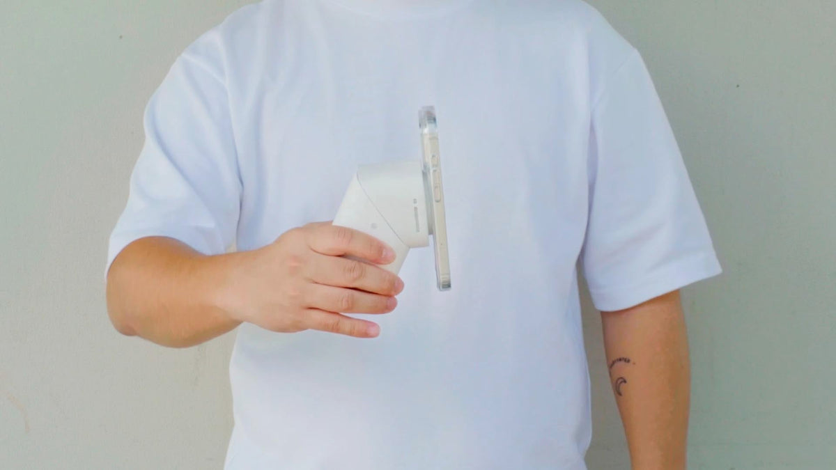 man holding a Qi2.2 wireless charger