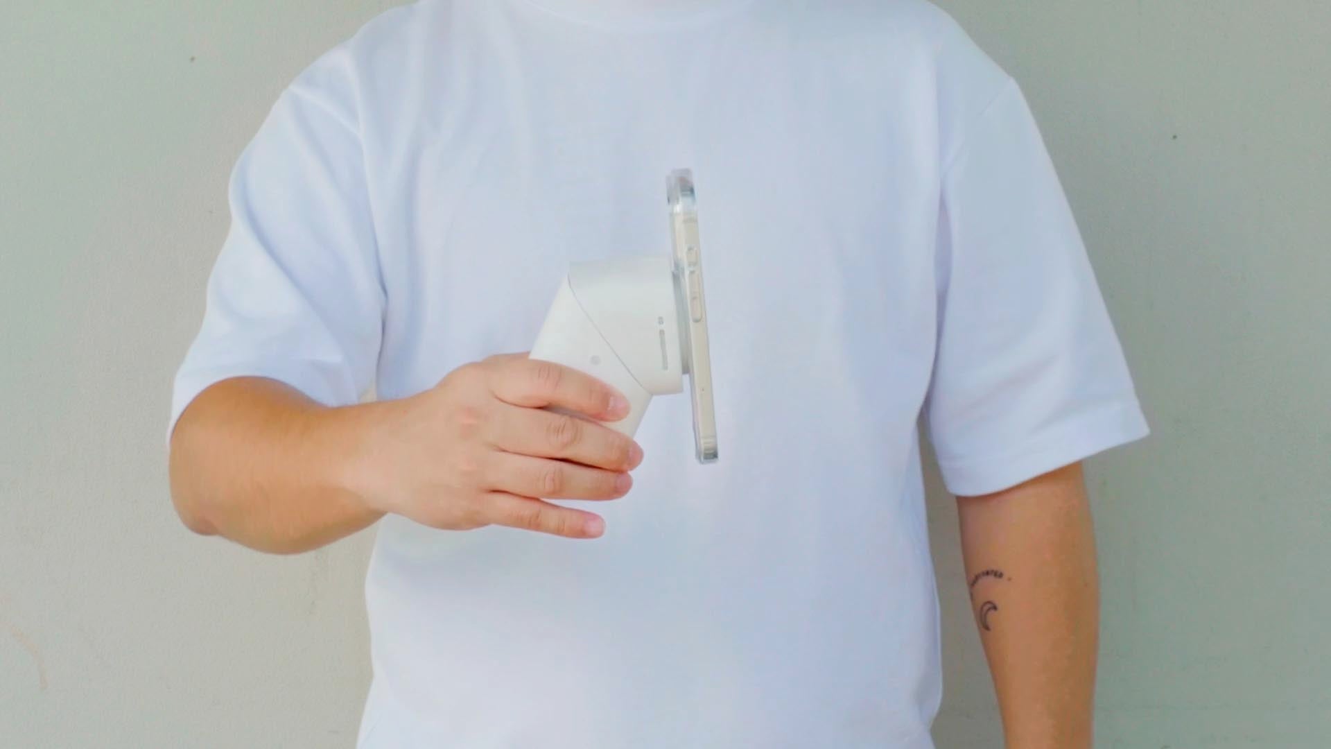 man holding a Qi2.2 wireless charger