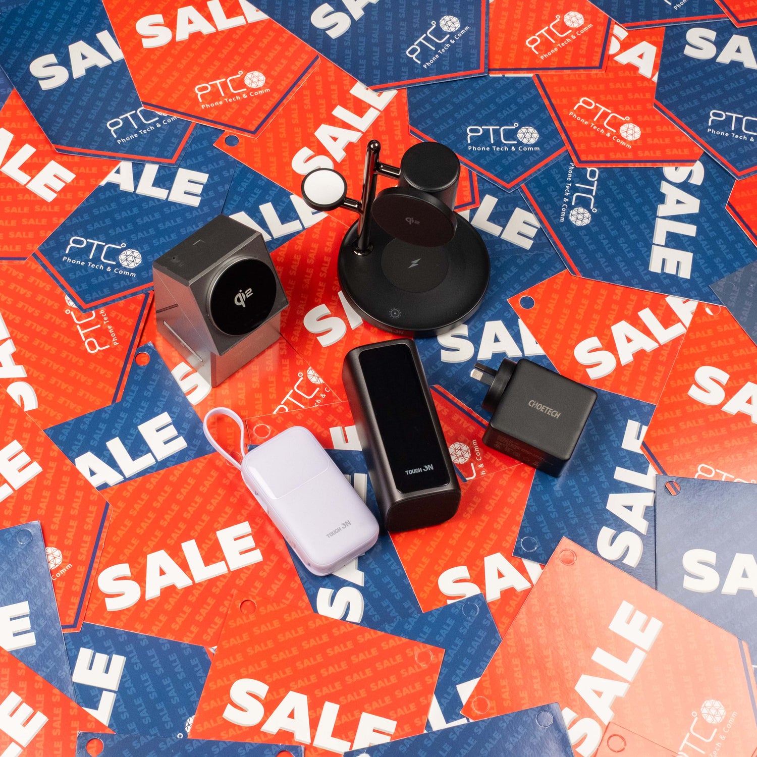 power banks and wireless charger sitting on sale background