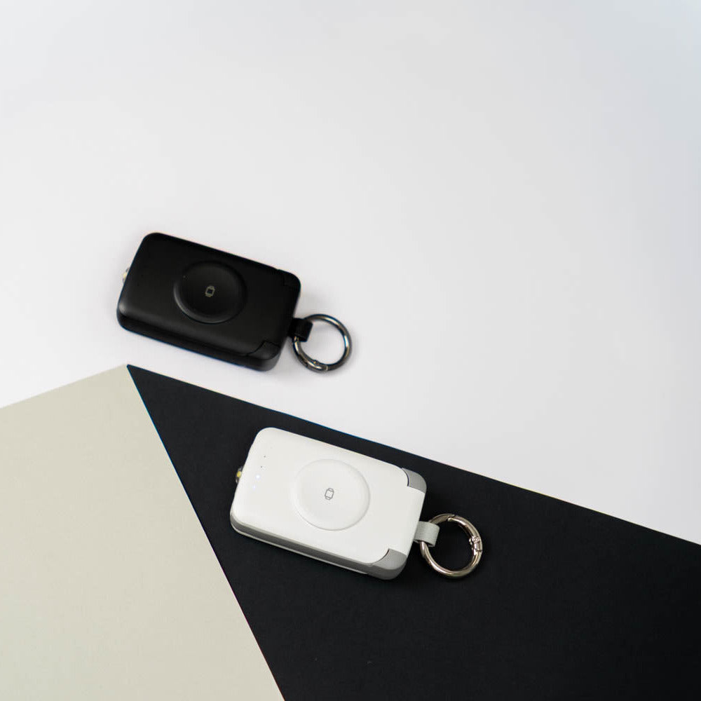 Black and white PTC WatchGo 2000 power banks side by side
