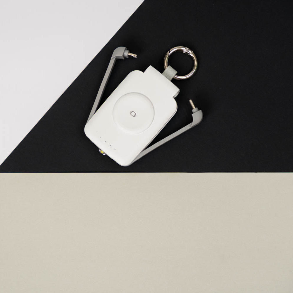 White PTC WatchGo 2000 power bank with keyring, seen from above
