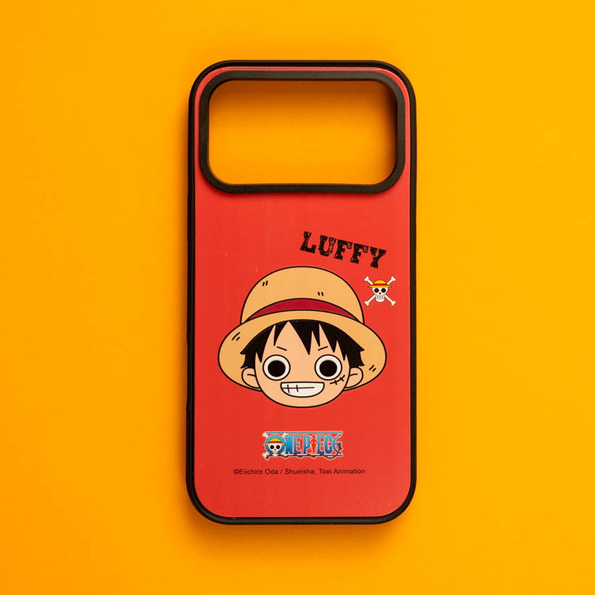 One Piece Luffy skin fitted in a MagSafe case, shown flat on orange