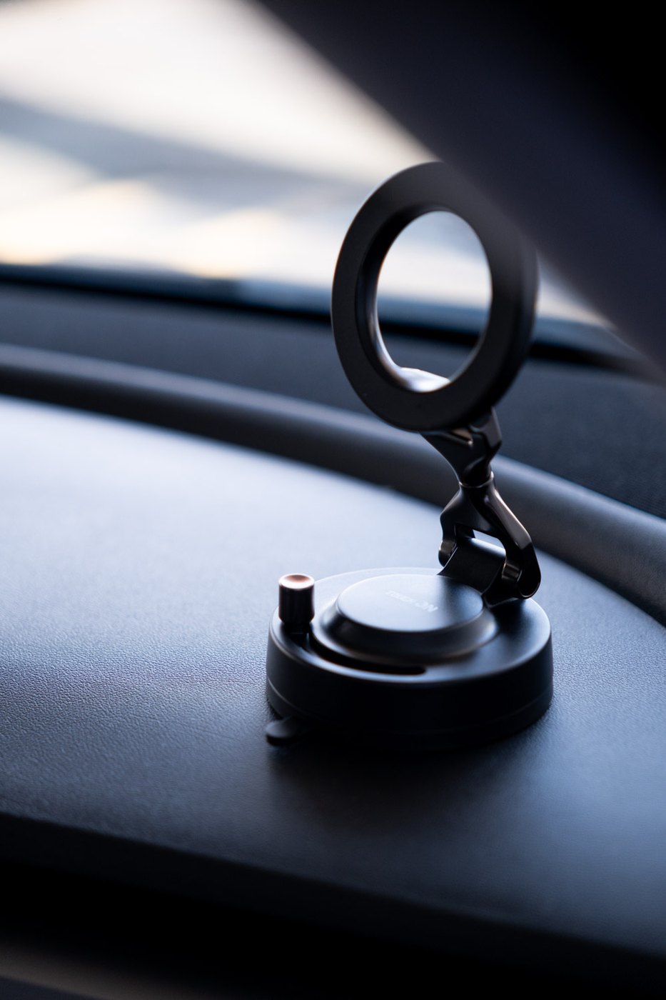 Close-up of the Tough On MagFlex nano-gel suction base on a dashboard